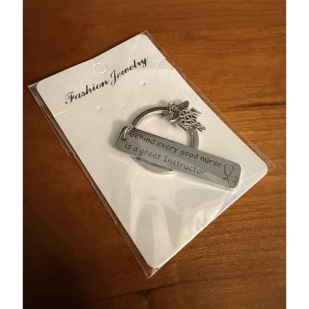 Silver Nurse Charm Keychain "Every good nurse has a great instructor"